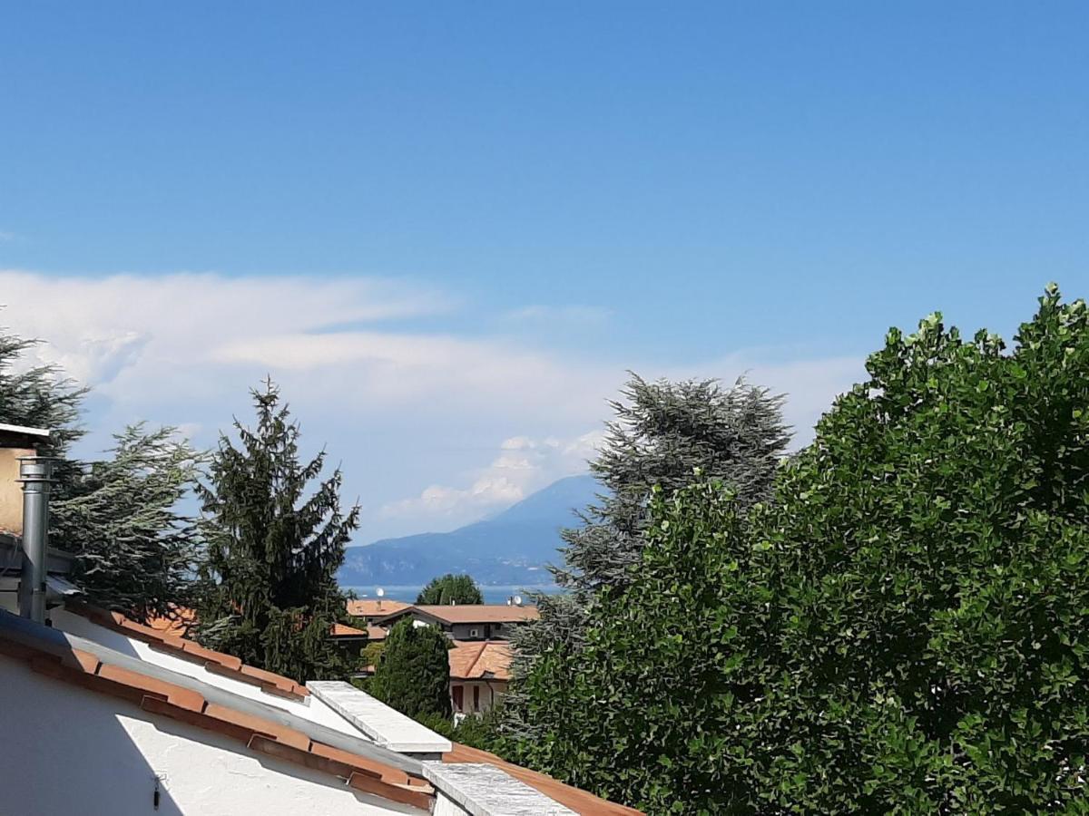 Appartamento Genziana - Con Vista Piscina E Garage Сирмионе Экстерьер фото